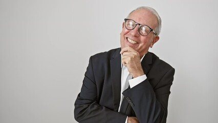 Wall Mural - Grinning elder gentleman in business clothes, confidently posing with crossed arms and hand on chin, radiating positivity. sharp, mature face isolated on white.