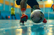 a futsal player's feet dribbling and passing the ball with quick footwork on the indoor court