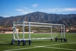 Synthetic turf football field with soccer goal, green grass, and goal net shadow