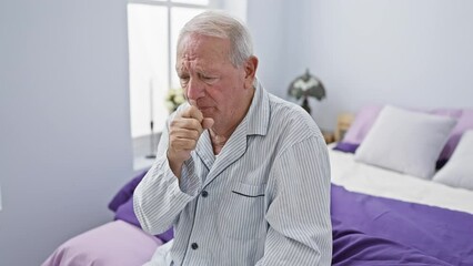 Canvas Print - Unwell senior man in pyjamas coughing on bed, a health care concern signalling cold or bronchitis in the cosiness of his bedroom.