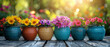 Colorful flowers in pots on a wooden terrace.