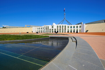 Wall Mural - Shallow circular pond in front of the Parliament House of Australia on Capital Hill in Canberra, Australian Capital Territory