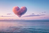 Fototapeta Niebo - Pastel Heart-Shaped Cloud Over Serene Sea at Sunset. Generative AI.
