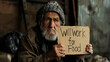 © Erzsbet - Old homeless man with cardboard Will work for food board