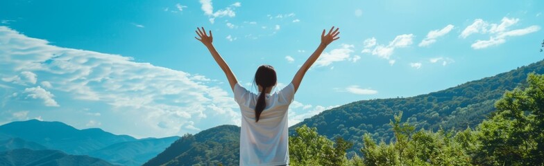 Wall Mural - A person wearing white is standing with their arms raised in front of the mountains, facing away from us and enjoying nature's beauty under bright sunlight Generative AI