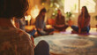 © Justlight - At a cozy yoga studio students gather in a circle to practice guided meditation. The instructors soothing voice leads them through a visualization exercise helping them release