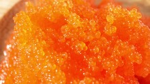 Tobiko, Derived From Flying Fish Roe, Is A Common Garnish In Japanese Cuisine. Prized For Vibrant Color, Crunchy Texture, And Unique Flavor. Seafood Concept. Food Background. 4K UHD.

