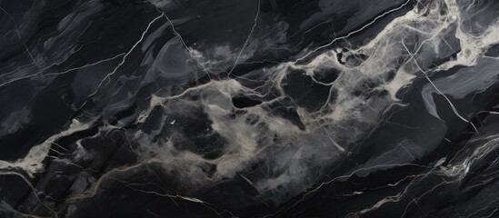 A closeup of a black and white marble texture resembles a cloudy sky or a geological phenomenon. The pattern creates a sense of depth and space, like a landscape or a cumulus cloud