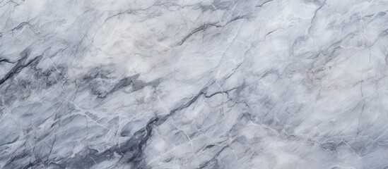 Wall Mural - A detailed closeup shot of a white marble texture resembling a frozen bedrock covered in snow, perfect for winter monochrome photography projects