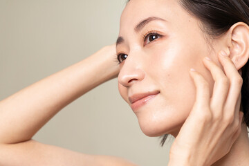 Beautiful portrait of healthy middle-aged woman with fresh skin and wet hair.
	