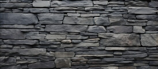 Poster - A detailed closeup of a grey stone wall with intricate brickwork pattern, showcasing the beauty of building material craftsmanship