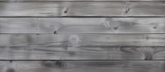 Wall Mural - A monochrome photography of a grey wooden wall showcasing tints and shades. The parallel wood flooring creates a pattern of rectangles, accented with metal details