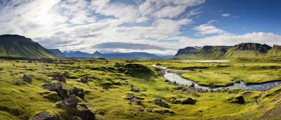 Wall Mural - Landscape in Iceland with vast expanses of green grasslands, high icy mountains, large rocks, rivers, bright blue skies , and house 