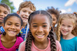 Group of joyful multiethnic children smiling outdoors on a sunny day