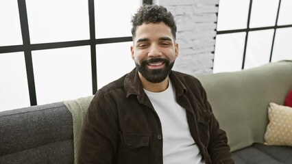 Canvas Print - Cheeky young man at home puffing cheeks with air, making hilarious crazy face expression