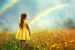 A young girl in a yellow dress stands in a field of flowers admiring a vibrant rainbow