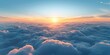 Aerial view of a sunset above clouds provides a breathtaking window perspective