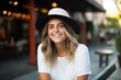 © Igor - Portrait of a beautiful young woman with hat smiling at the camera