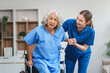 © NanSan - Nurse helping adult woman in hospital offer help and comfort create a welcoming atmosphere with a focus on patient care and wellness. Mature woman, nurse or person with disability in hospital