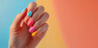 © Дмитрий Баронин - Bright multi-colored manicure on a woman's hand.