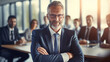 © Yuwarin - Successful businessman sitting confidently in conference room