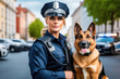 A female dog handler with a dog. Professional holiday Day of Dog Training Units concept. Pretty girl with dog, smiling and looking to camera.