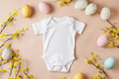 Blank white baby bodysuit mockup with a festive Easter theme