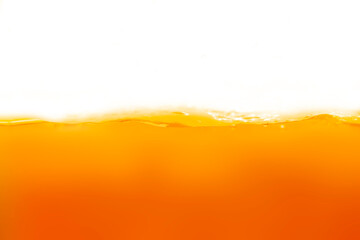 Poster - Close up bright orange juice texture for health and nature waves