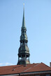 High spire of St. Peter's Church in old town of Riga under cloudless sky