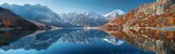 Fototapeta Góry - A stunning view of a mountain range mirrored in the calm waters of a lake, creating a breathtaking symmetrical reflection. The rugged peaks and valleys of the mountains contrast beautifully with the s