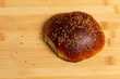 Traditional Moroccan Sweet: Qrashel on Wooden Cutting Board with Sesame Grains