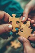 hands holding puzzle pieces in mutual cooperation