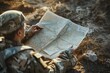 © Jorge Ferreiro - soldier with a map planning the route or tactics of the battle