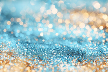 An abstract background of blue turquoise and gold glitter creating a dreamy bokeh effect.