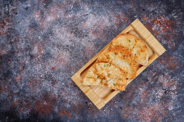 Wall Mural - Traditional Russian deep fried meat pies - chebureki.