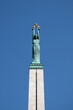 Top part of The Freedom monument on Brivibas Boulevard in Riga in sunny cloudless day