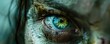 A close up of a person's eye with a greenish tint. The eye is surrounded by a blurry, messy area, giving the impression of a wild, untamed look