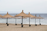 Fototapeta  - Sunbeds, Umbrellas and Hammocks in a beach