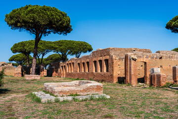 Wall Mural - Exterior facade in ruins of ancient roman buildings at archaeological park in Italy