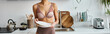 cropped banner of african american woman in lingerie holding clean plates in modern kitchen