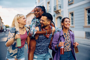 Wall Mural - Young carefree people having fun while going on music festival in summer.