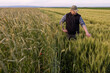 © Dusan Kostic - Young farmer in wheat fields