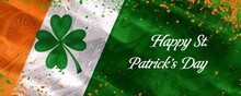 Shamrock On The Irish Flag With Happy St. Patrick's Day Text, Festive Orange And Green Splatters Enhance The Celebration Theme