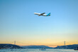 Passenger plane flying over the Bosphorus of Istanbul.
