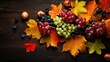 Fresh autumn fruits and autumn leaves on the table. Autumn season celebration concept background.
