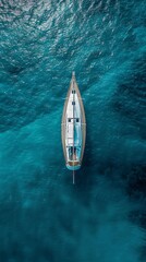 Wall Mural - Aereal view of a boat floating on a turquoise blue ocean