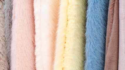 Leinwandbilder - Multi-colored textile fabrics hang in a market or store as an abstract background