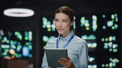 Data center woman working tablet computer looking distance at office closeup