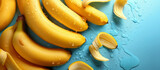 Fototapeta Tulipany - Fresh ripe yellow bananas on blue background top view. Healthy food, tropical fruit. 