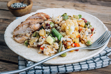 Wall Mural - Asian fried rice with vegetables and chicken